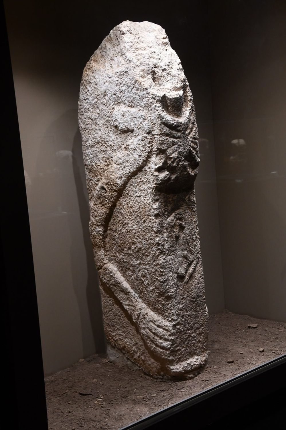 A Karahan Tepe pillar carved with a double-fox depiction, now in the Şanlıurfa Archaeology Museum — the same animal, 40 km east of Göbekli Tepe.