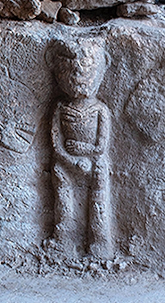 The Sayburç male figure carved almost in the round, projecting from the wall. Male figures like this dominate the region's surviving imagery.