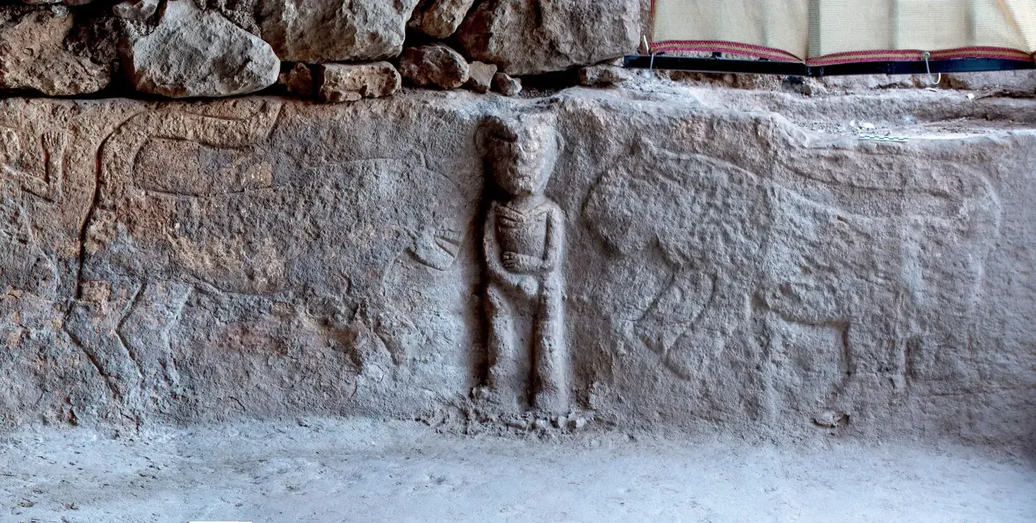The carved bench relief at Sayburç, a man in high relief flanked by animals