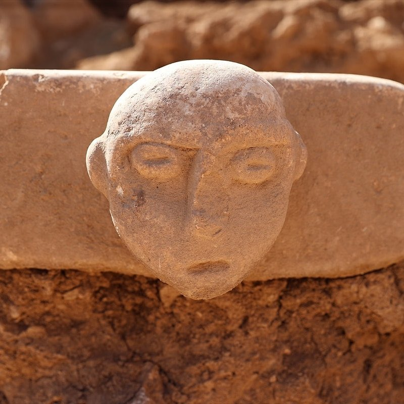 Sefertepe joins the family: two carved faces and a double-sided bead