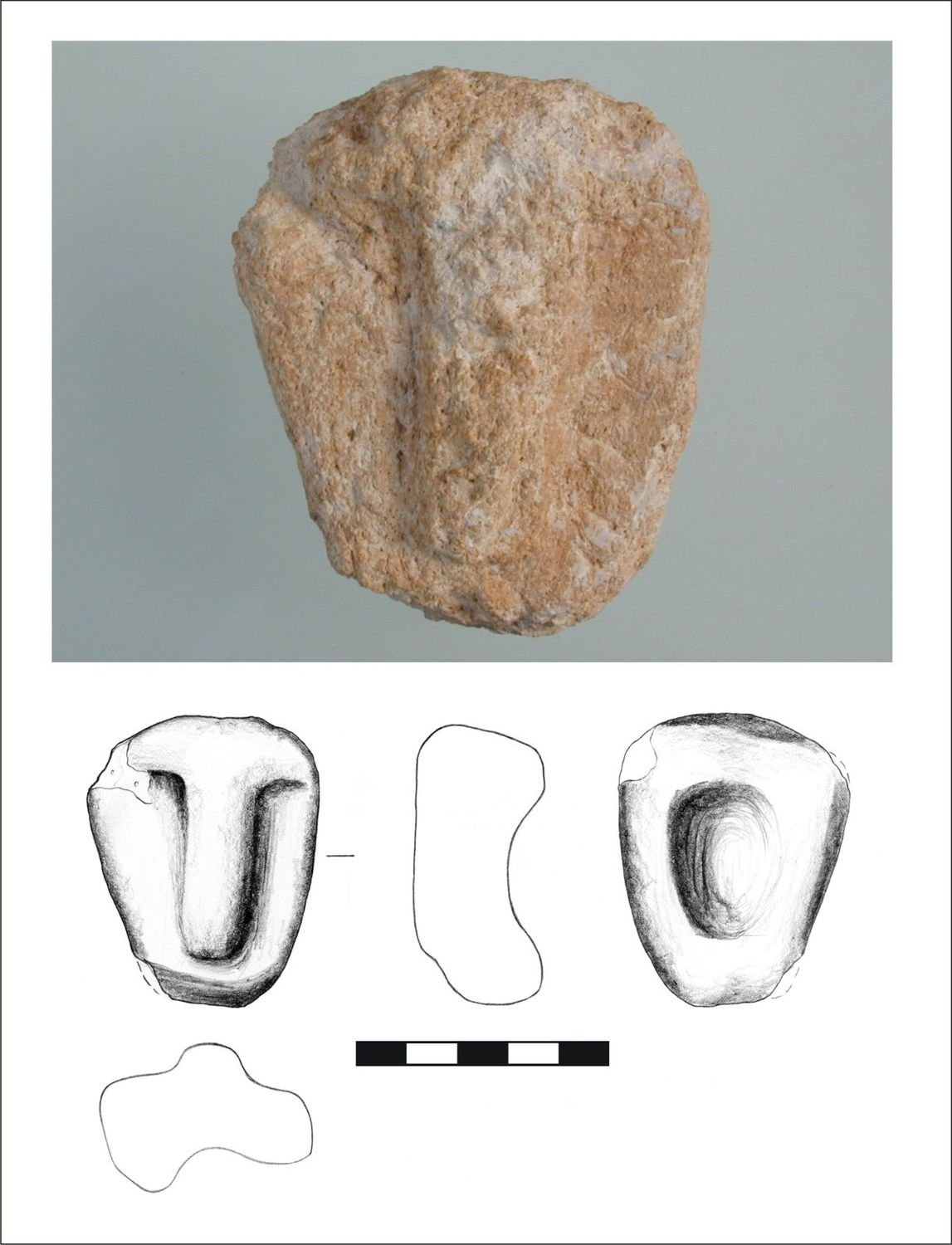 A miniature stone mask from Enclosure D, deposited near the central pillars.