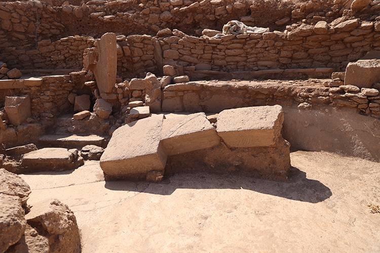 A working dig. Tiered benches and freshly exposed structures — Karahan is being excavated now, so what you see changes from one season to the next.